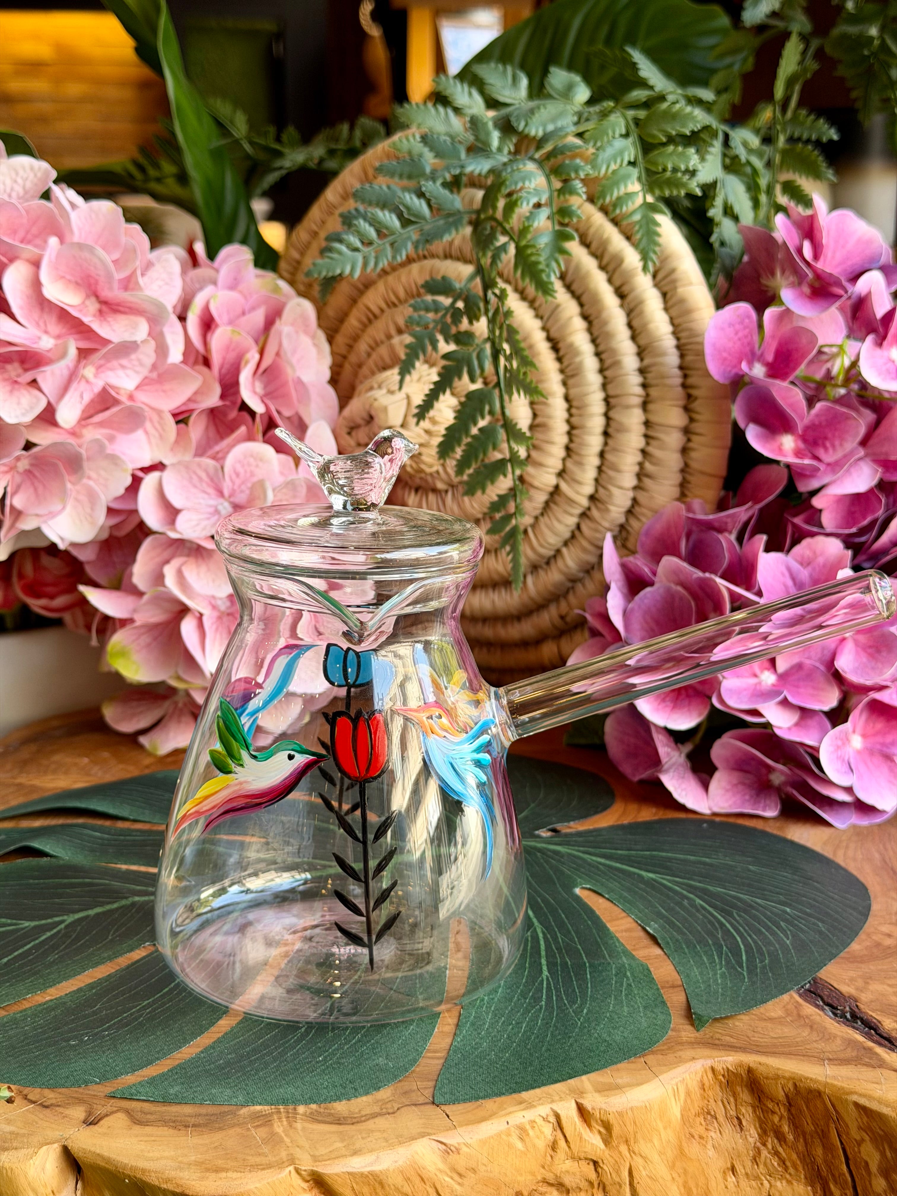 transparent coffee pot bird