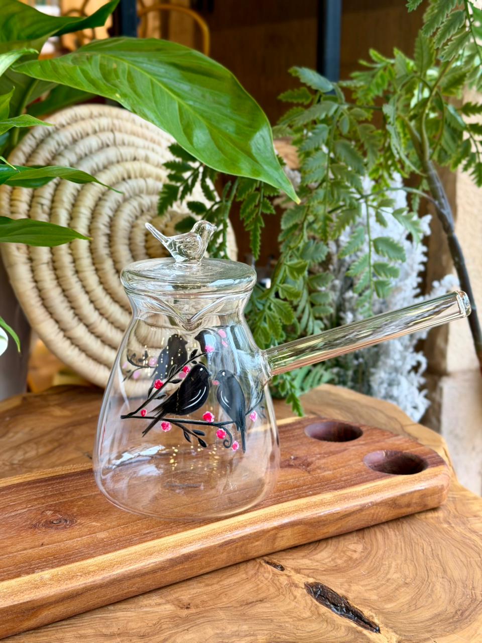 transparent coffee pot bird